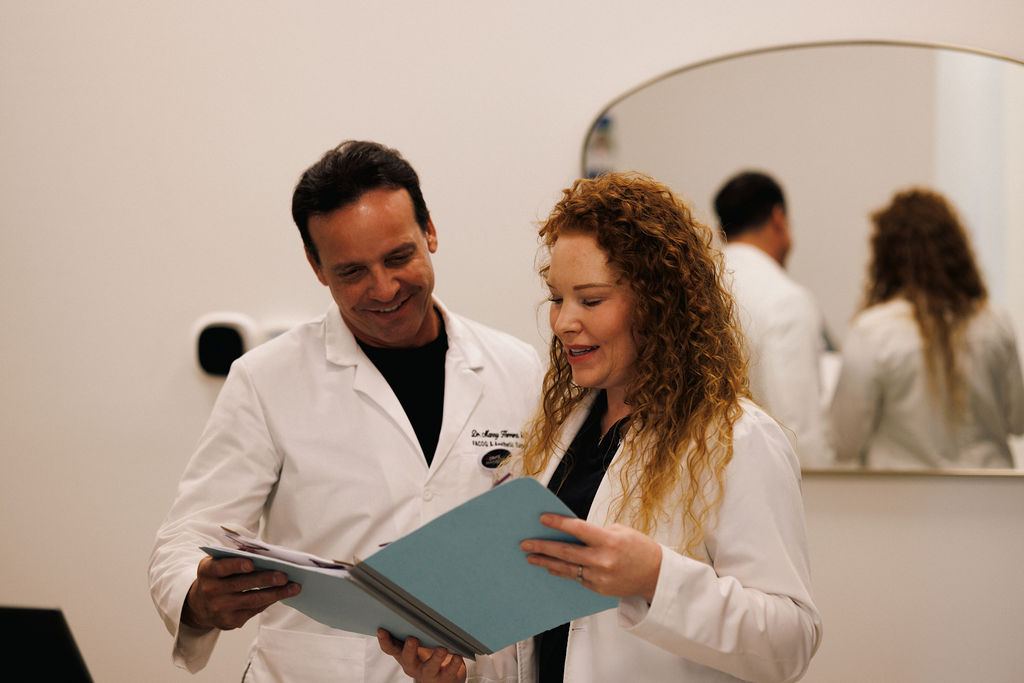 Two gynecologists in Winter Garden reviewing a patient's information.